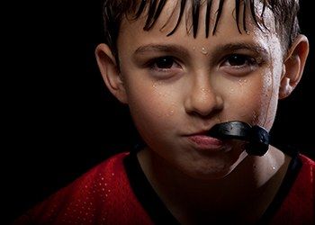 Child with sports mouthguard