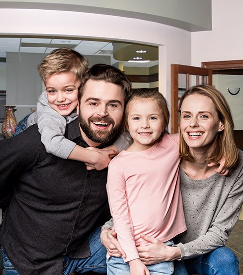 Smiling mother father and two children