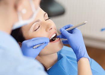 Relaxed woman receiving dental treatment